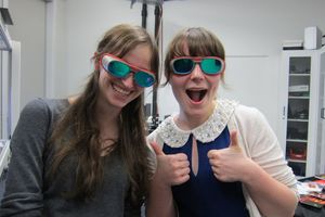 two students with laser protection goggles.