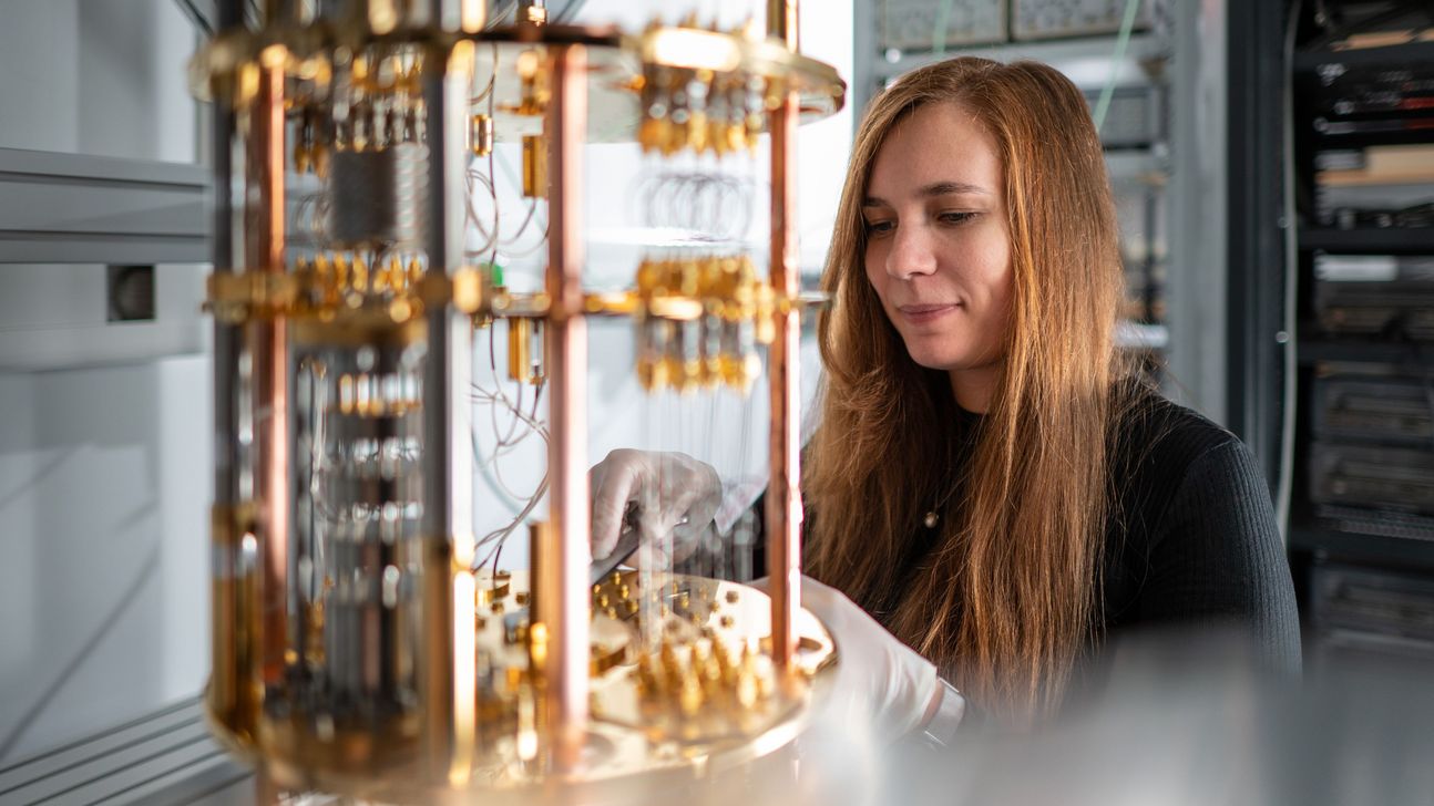 A researcher is looking at a quantum computer.