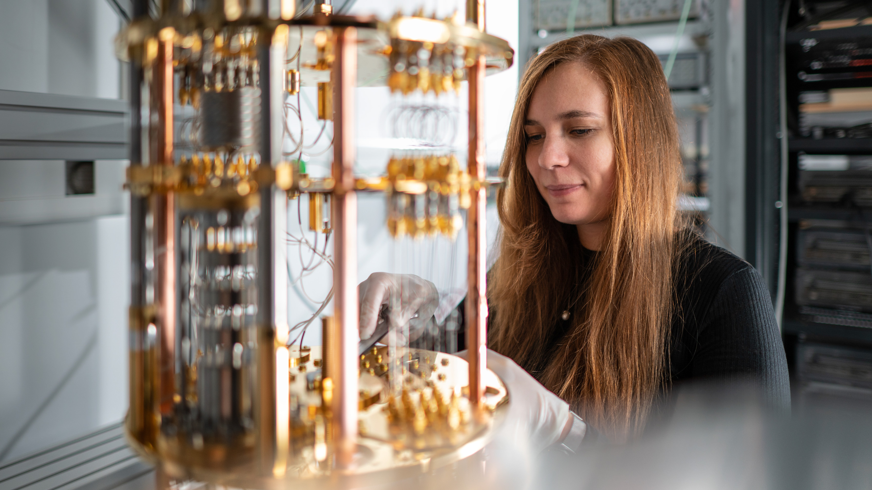 A researcher is looking at a quantum computer.